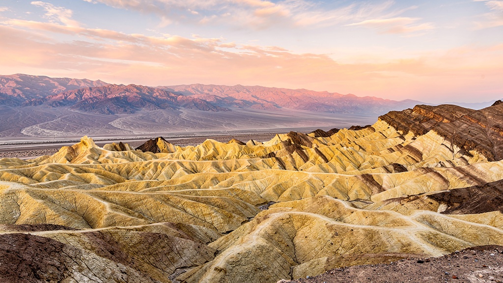 Death Valley Zabriskie Point badlands with dramatic eroded golden hills