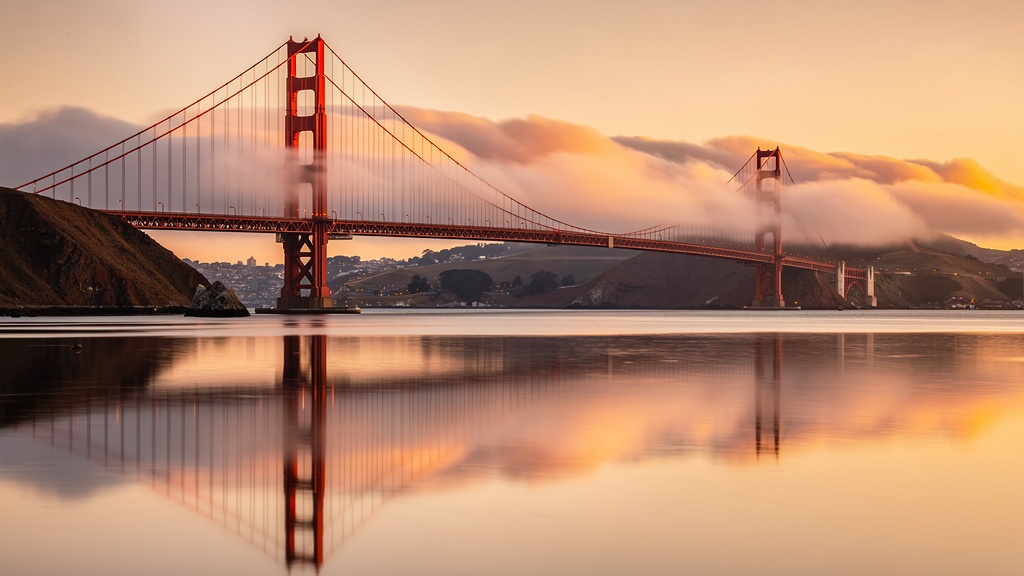 Golden Gate Bridge at golden hour with fog