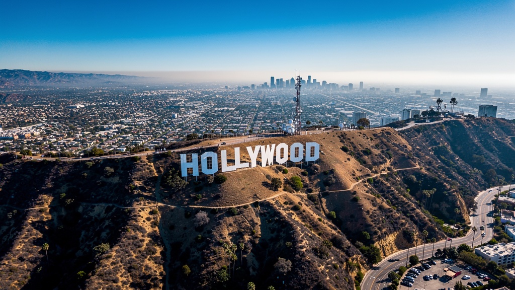 Hollywood Sign on the hill with Los Angeles cityscape below